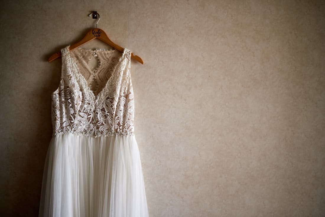 An A-line designer sample wedding dress on the rail at Bo & Co